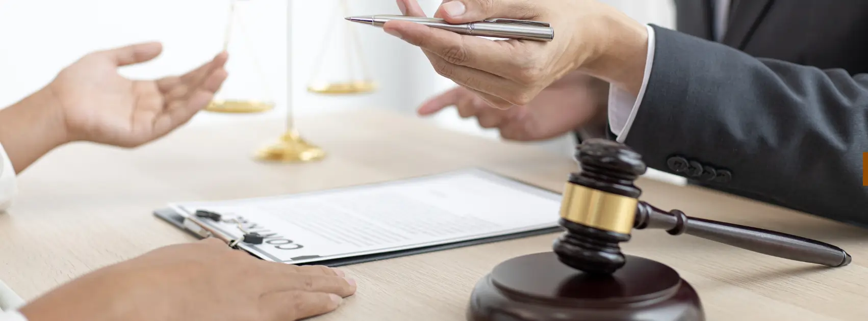 Legal consultation with scales of justice and a gavel